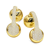 Gold hoop earrings with clear gemstones on a white background