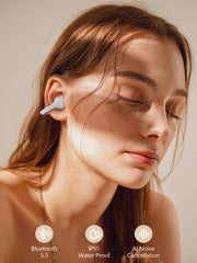 Close-up of a woman wearing wireless earbuds with product features displayed.