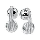 A pair of white gold clip-on earbuds with a diamond-like pattern on the surface.